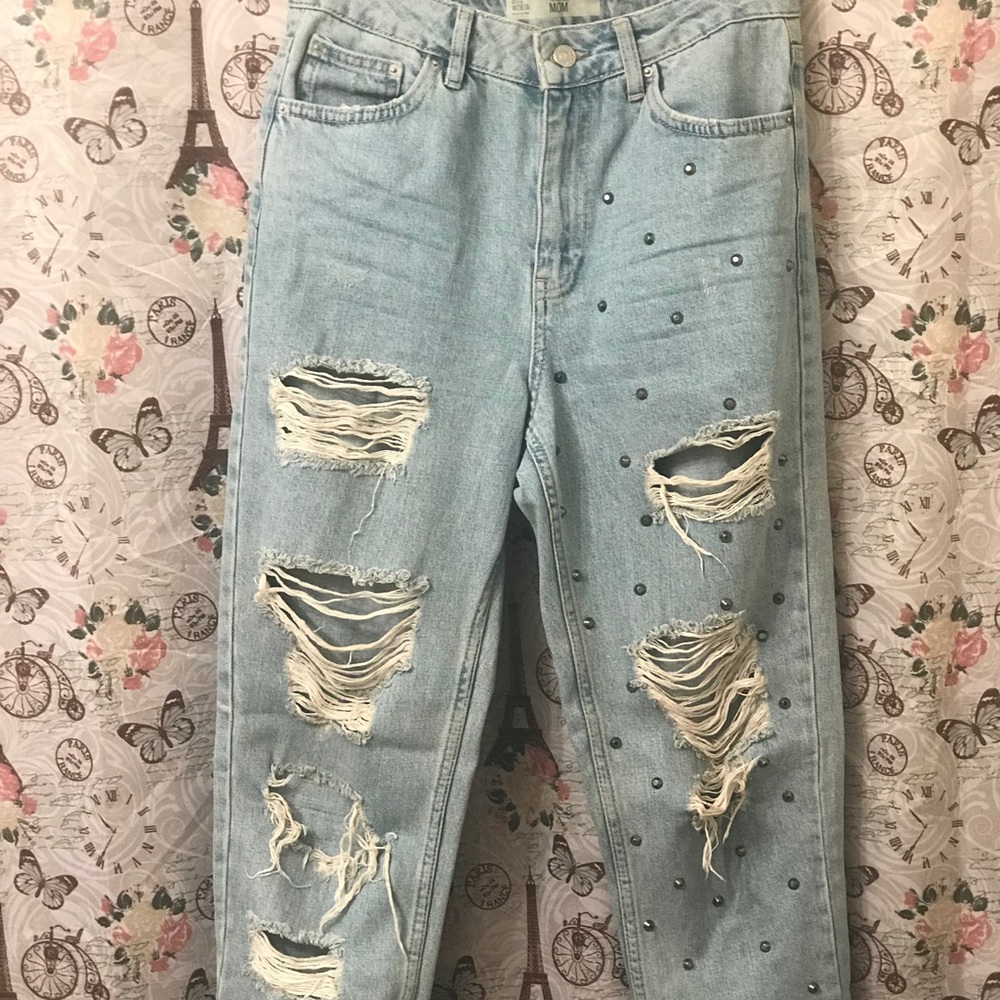 Distressed denim jeans